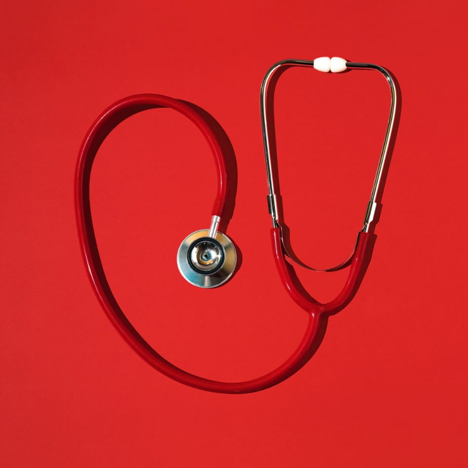 Stethoscope on a red background