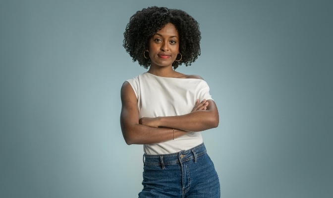 A woman walking with a suitcase at the train station