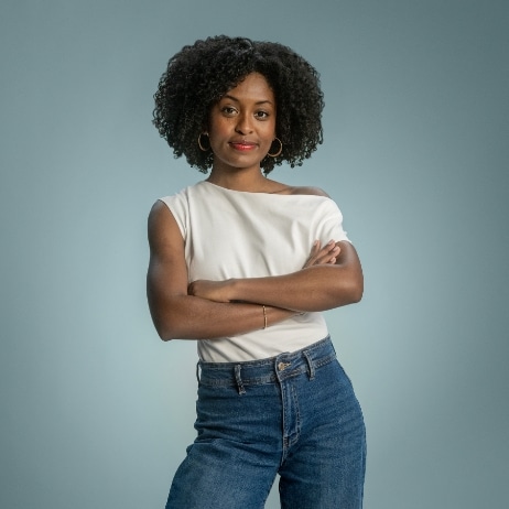 Woman standing and smiling with folded arms