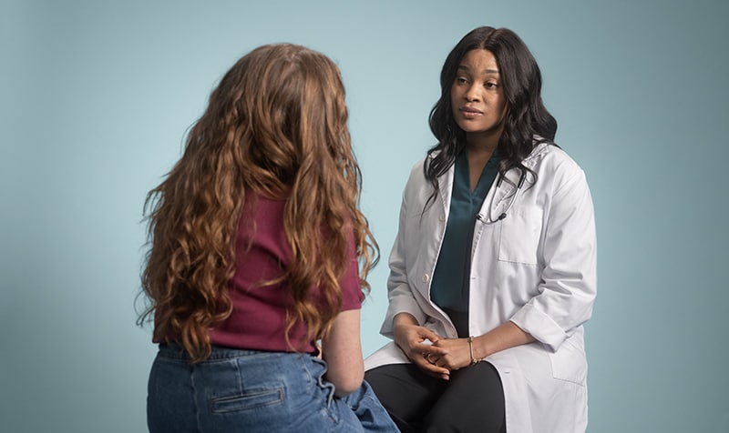 Image of woman speaking with healthcare provider